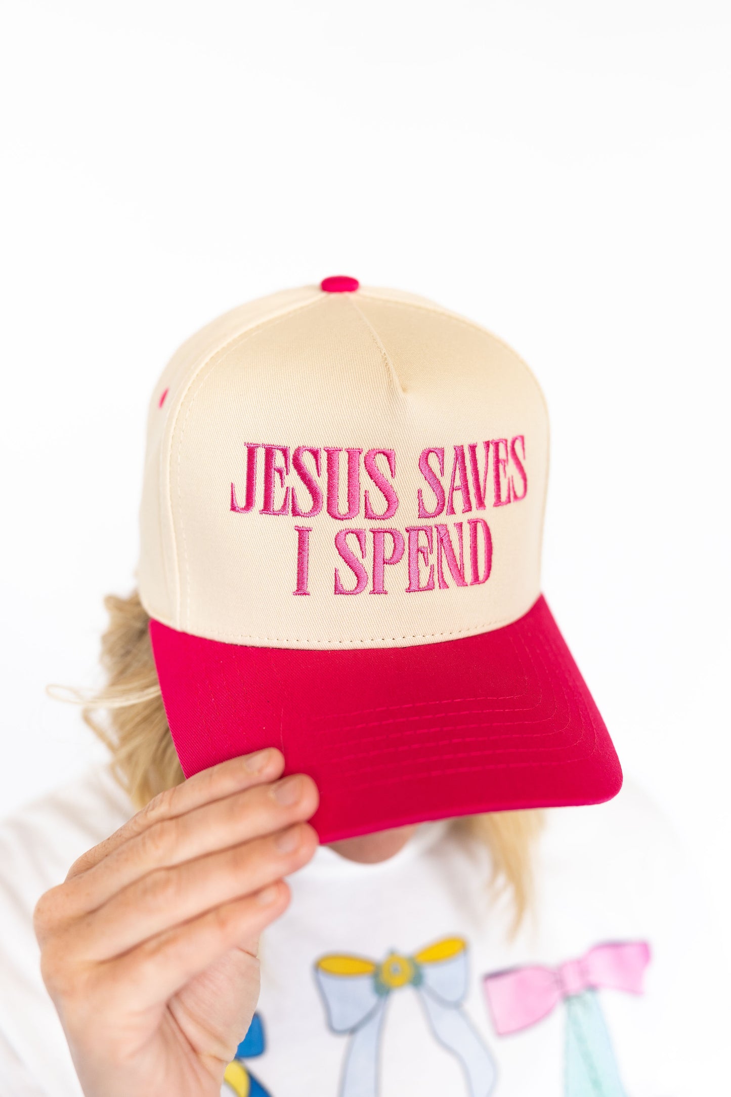 Jesus Saves, I Spend embroidered hat, tan cap with hot pink bill and embroidered writing