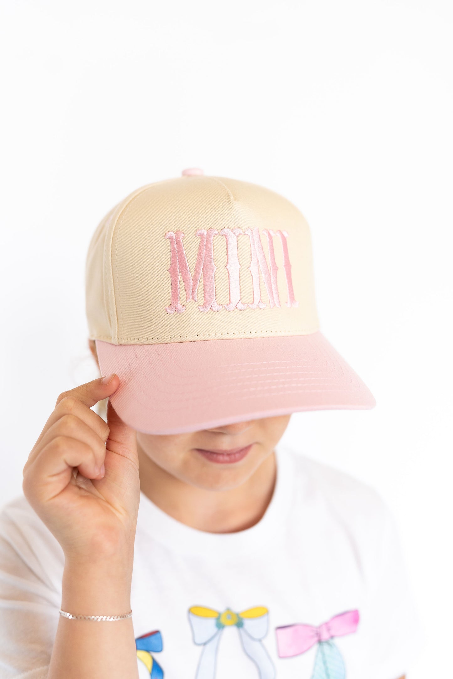 Embroidered โMINIโ in bubblegum pink, Cream crown with light pink bill, Adjustable snapback for a perfect fit, Ponytail-friendly design for little fashionistas, Lightweight & comfy for everyday play