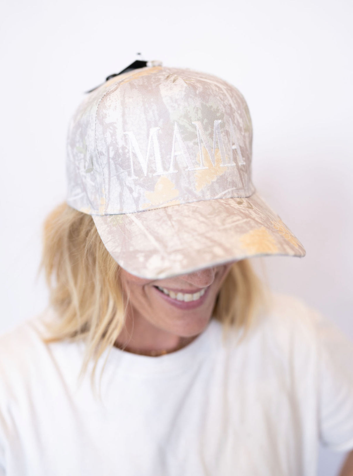 Neutral camo print with white embroidered MAMA detail
Adjustable back for the perfect fit
Lightweight + breathable for all-day wear
Effortless style—throw it on and go!