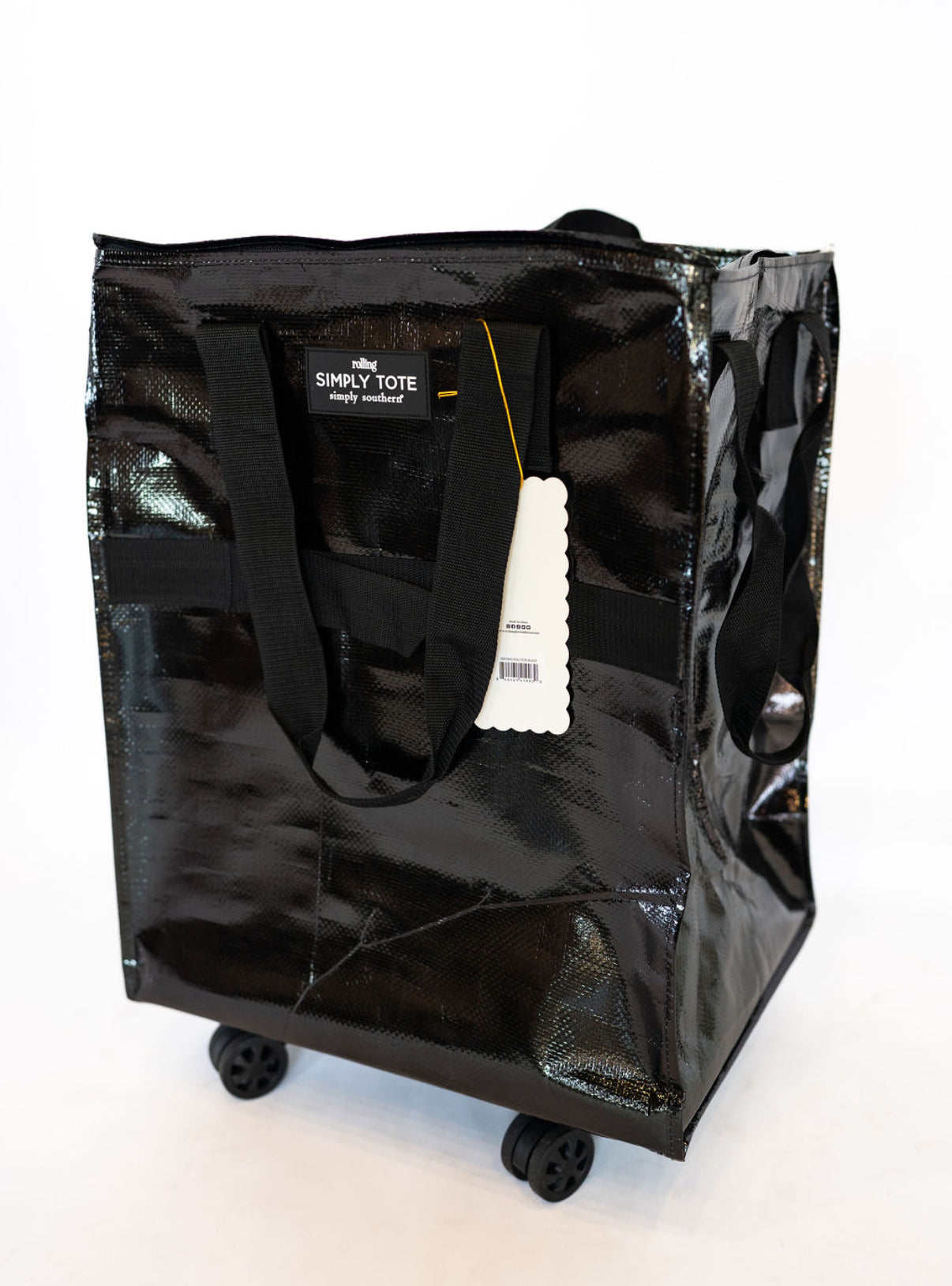 Travel light, roll easy, and look stylish with the Simply Southern Rolling Tote in sleek black. Perfect for shopping trips, market hauls, travel, or everyday errands, this tote is designed to keep up with you—without weighing you down.
**Details:**
* Durable, water-resistant material for long-lasting use
* Four smooth-glide wheels for effortless rolling in any direction
* Comfortable dual handle