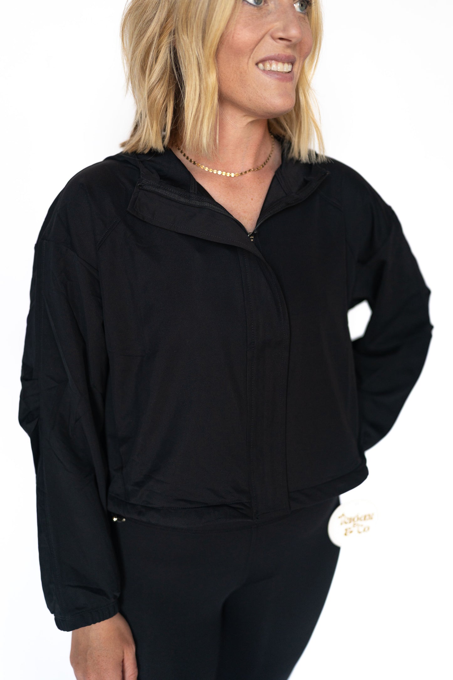 Lightweight, breathable, and perfectly cropped, this zip-up wonder was made for the busy, bold, and always-on-the-move babe. Whether you're headed to pilates, preschool drop-off, or powering through errands like a queen, this jacket’s got your back (literally).
Details:
Lightweight athletic fabric
Full front zip with hidden panel
Adjustable cinchable hem
Built-in hood
Elastic wrist cuffs for secure fit
Slightly cropped length — perfect with high-rise leggings
True black for a sleek, goes-with-everything