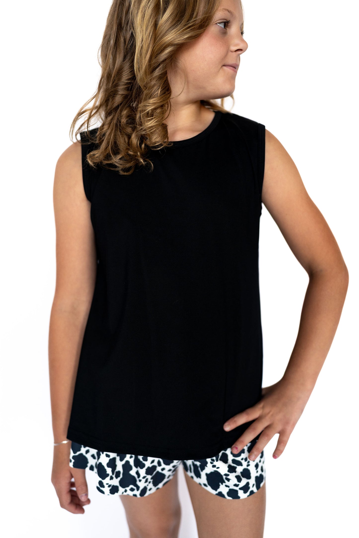 This sleeveless staple is made for everything from playground adventures to picture-perfect moments, featuring a stylish tulip-back detail that adds extra flair to a simple silhouette.
Soft, breathable, and effortlessly cool — it's an easy win for any outfit combo!