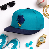 Teal and navy baseball cap with embroidered silhouette logo and gold 24 chain baseball snapback hat
