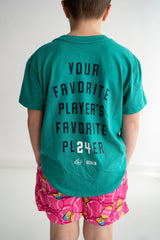 Boy wearing teal baseball graphic t shirt with bubble gum design and pink baseball print shorts
