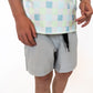Solid light gray outer layer for a clean, versatile look

Inner layer with pastel checkered print for a pop of fun

Elastic waistband with adjustable drawstring for the perfect fit

Lightweight, breathable fabric for all-day comfort

Ideal for sports or casual wear

Available in boys sizes 2T–9/10