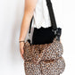 14” x 12” x 7.5”
100% polyester
Puffy quilted material
Zipper closure
Magnetic clasp for extra security
Interior zipper pocket for small essentials
17” handle straps for easy carry
Detachable, adjustable over-the-shoulder strap (extends to 47”)