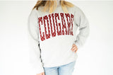 Women’s heather grey Cougars mock neck sweatshirt featuring oversized crimson COUGARS lettering with white polka dot details, perfect for game day and tailgating.