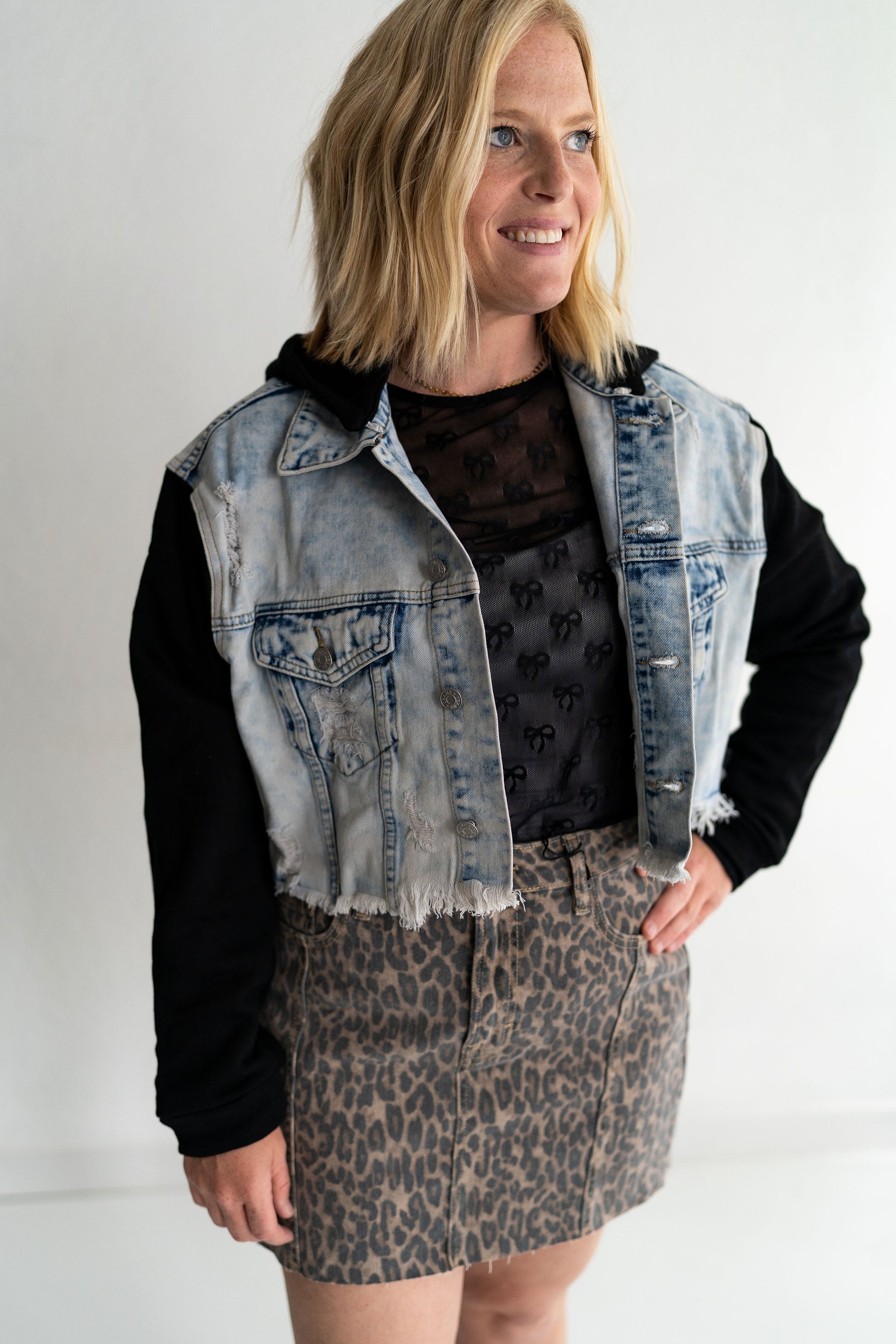 Designed by Veveret – masters of cool and casual, Bold black knit sleeves and hood for contrast, Light wash denim body with a relaxed, cropped fit, Button-up front + front pockets = cute and practical