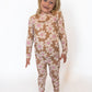 Made from buttery-soft bamboo fabric that’s breathable and temperature regulating
Ribbed texture for extra stretch and comfort
Playful tan base with ivory daisies and pink centers for a cheerful look
Two-piece set with a long-sleeve top & matching pants
Hypoallergenic and eco-friendly fabric that moves with them
