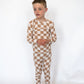 Made from ultra-soft, breathable bamboo viscose that keeps them comfy all night

Ribbed texture for extra stretch and easy movement

Stylish tan-and-ivory checkered “Dunes” print

Two-piece set with a long-sleeve top &amp; matching pants

Naturally hypoallergenic and gentle on sensitive skin
