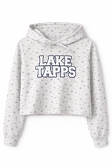 Light grey cropped hoodie with blue floral print and white chenille-style “Lake Tapps” lettering outlined in blue, displayed on a white background with soft shadow