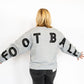 Classic grey with bold GAME DAY print on the front
Oversized FOOTBALL lettering across the back + sleeves
Soft, midweight fabric perfect for layering on chilly nights
Relaxed unisex fit – great for pairing with jeans or leggings
Sizes: S–XL