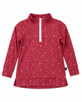 Red youth quarter-zip athletic pullover with allover football print, white zipper, and long sleeves styled in a flat lay with black athletic shorts, football, football hat, whistle, eye black, and black athletic sneakers on a white background.
