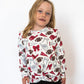 Details:

All-over maroon, silver, and white game day graphic print
Soft, stretchy athletic fabric for easy movement
Lightweight and breathable for all-day comfort
Stylish criss cross hem detail at the front
Ideal for spirit days, tailgates, and supporting your team in style
