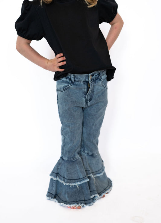 Light wash denim for a classic, vintage-inspired look
Tiered flared bottoms with raw hems for extra style points
Functional front & back pockets
Button and zip closure for a secure fit
Soft, durable fabric with a comfortable feel
Available in girls sizes 3–8