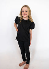 Timeless black color for endless outfit pairings

Sweet scalloped hems for a touch of charm

Soft, stretchy fabric for maximum comfort and movement

Slim fit with a straight leg cut

Available in toddler &amp; youth sizes 2T–9/10