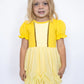 Soft puff sleeves with ruffle trim for a classic princess look
Golden bodice with sparkling trim accents
Gathered, ruched skirt for an elegant ballgown feel
Sweet bow-back cutout detail for extra charm
Built-in matching shorts for all-day comfort and play
Lightweight, stretchy fabric that moves with your little one