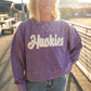 **Huskies Corded Crew: Purple Pride, Golden Spirit**

Show off your Husky pride with this irresistibly cozy purple corded crew! Designed with ultra-soft, mineral-washed fabric, it features standout white chenille lettering detailed with shimmering gold—because game days deserve a little glam! With its easy-going fit and vintage-inspired style, you'll be comfy and spirited all season long.

**Details:**

* Soft, mineral-washed purple corded fabric
* White chenille "Huskies" lettering with gold glitter outlin