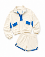 Katydid yellow two-piece athletic set featuring a quarter-snap pullover with blue contrast details and matching elastic-waist shorts with blue trim on a white background.