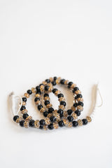 Set 4 in1 beaded phone charger with leopard and black beads on a white background