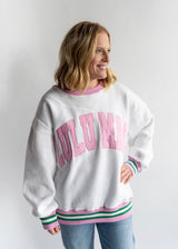 Women's and teen Lulu Mac White & Pink Social Club Crewneck with pink text that says LULU MAC. 