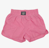 Youth bubblegum pink athletic shorts featuring a lightweight fabric, elastic waistband, relaxed fit, and Lulu Mac logo detail.