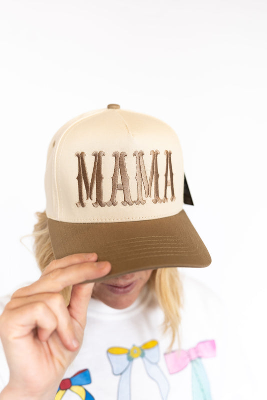 Structured trucker fit with snapback adjustability,
Cream front with bold brown “MAMA” embroidery,
Earthy tan bill for that go-with-everything vibe
Comfy, breathable, and ready for messy bun days
