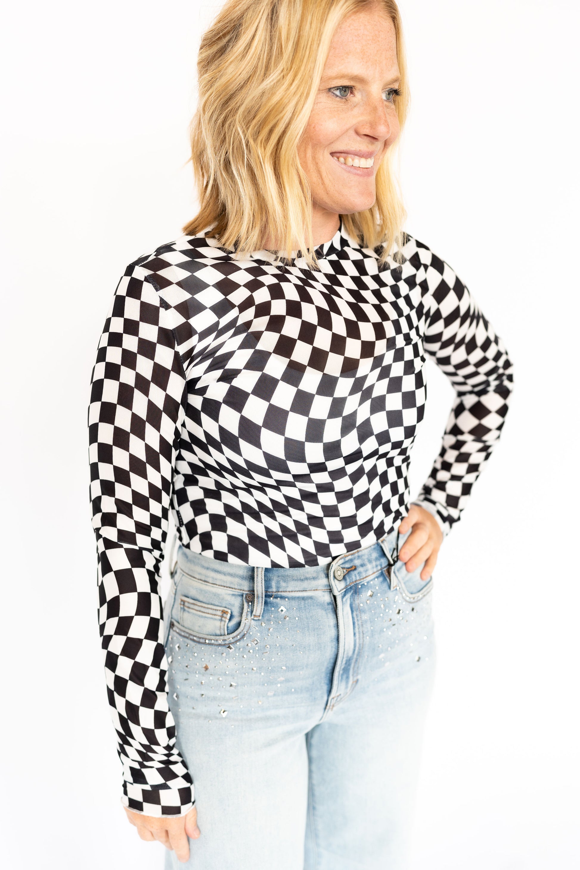 Optical Illusion Mesh Long Sleeve, Black + white distorted checkerboard print
Soft, stretchy mesh for a fitted look
Lightweight and breathable
Perfect under graphic tees, over bralettes, or tucked into denim
A little edgy, a lot iconic