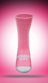 Pink sock with white cross and text "Romans 8:31"  on a pink background