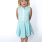 Sporty, sweet, and made for twirling—this athleisure dress brings all the joy! With a cheerful pink smiley face print on the happiest aqua blue, your little sunshine will be grinning from playground to playdate.