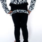 hese leggings are soft, stretchy, and designed for comfort, whether your little one is cartwheeling through the day or strutting into dance class with flair. Pair them with the matching cow print jacket for the full Teigan &amp; Co. statement set!

Details:

Black full-length leggings with stretchy waistband

Ruffle detail at the back in custom cow print

Soft, breathable athletic fabric perfect for play

Designed to move with your mini

Toddler + Youth sizing available

Pairs with our Cropped Cow Print Ath