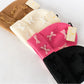 Soft ribbed knit fabric
Adorned with mini velvet bows for a feminine flair
Fold-over cuff for extra warmth and style
Available in multiple colors: Camel, Cream, Hot Pink, and Black
One size fits most