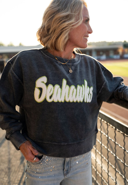 Game day just got a major glow-up. This washed corded crew is the ultimate blend of cozy comfort and bold fan energy, with a textured vintage look and standout chenille Seahawks patch that says, "Yes, I'm here for the football and the fashion."

🟢 Details:

Mineral-washed charcoal corded fabric with soft fleece feel
Oversized white & lime green chenille Seahawks patch
Drop-shoulder fit with ribbed neckline, cuffs & hem
Relaxed, slightly oversized fit
Available in Women’s sizes S–XL
