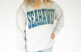 Women’s heather grey Seahawks mock neck sweatshirt featuring oversized navy SEAHAWKS lettering with bright green polka dot details, perfect for Seattle game day and tailgating.
