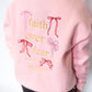 Soft pink crewneck sweatshirt
Front: small embroidered bow detail
Back: “Faith Over Fear” embroidery with bow accents + Psalm 118:6
Relaxed, unisex-inspired fit for all-day comfort
Cozy cotton blend
Women’s sizes XS–XXL