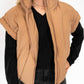 Warm umber quilted puffer style
Lightweight yet warm – ideal for layering
Sleeveless design with cuffed shoulders for a modern look
Full front zipper closure for easy wear
High collar to keep you cozy
Available in sizes XS-XXL
