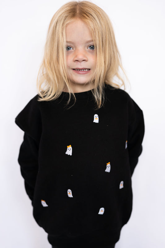 Black crewneck with allover embroidered ghost accents

Ghosts feature orange bows + bow ties for extra charm

Soft + cozy fabric for everyday wear

Unisex fit for easy styling