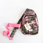 Pink and green camo print with coordinating pink zippers and strap
Adjustable crossbody strap for the perfect fit
Multiple zip compartments to keep essentials organized
Lightweight, durable canvas construction
Gold “The Sling Bag” tag with signature Simply Southern branding
Size: approx. 12" H x 7" W x 3" D