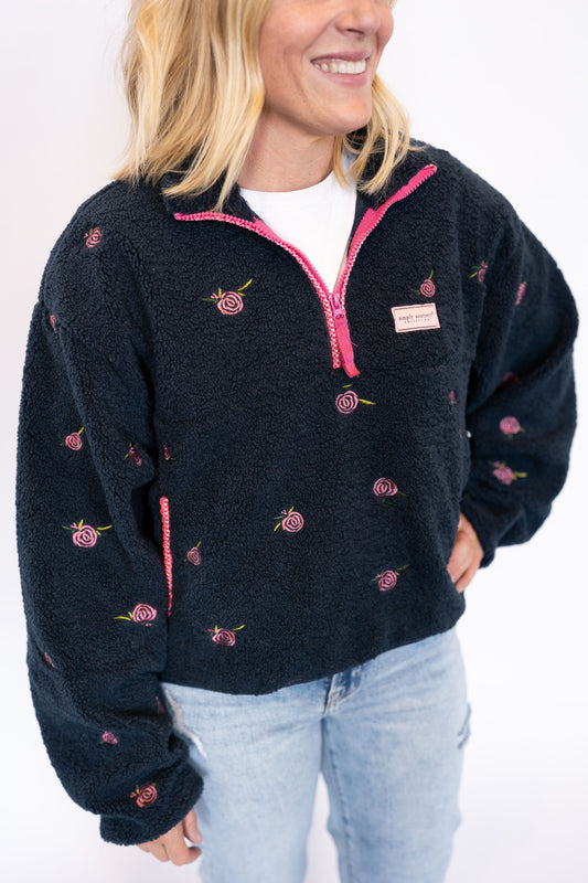avy sherpa pullover with allover pink rose embroidery

Half-zip closure with hot pink zipper detail

Relaxed fit with roomy sleeves for ultimate comfort

Simply Southern branded patch on chest

Soft + warm for everyday layering
