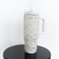 Fully embellished with pearls and rhinestones
Handle for easy carrying
Flip-top lid with reusable straw
Double-wall insulation keeps drinks hot or cold for hours
40 oz capacity
Fits most car cup holders