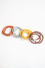 Beaded phone chargers in different sport themes. Featuring basketball, soccer, softball and football