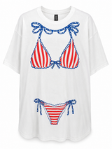 White oversized women's cover-up T-shirt featuring a red, white, and blue patriotic bikini graphic with star-print bows and rhinestone accents on the front.