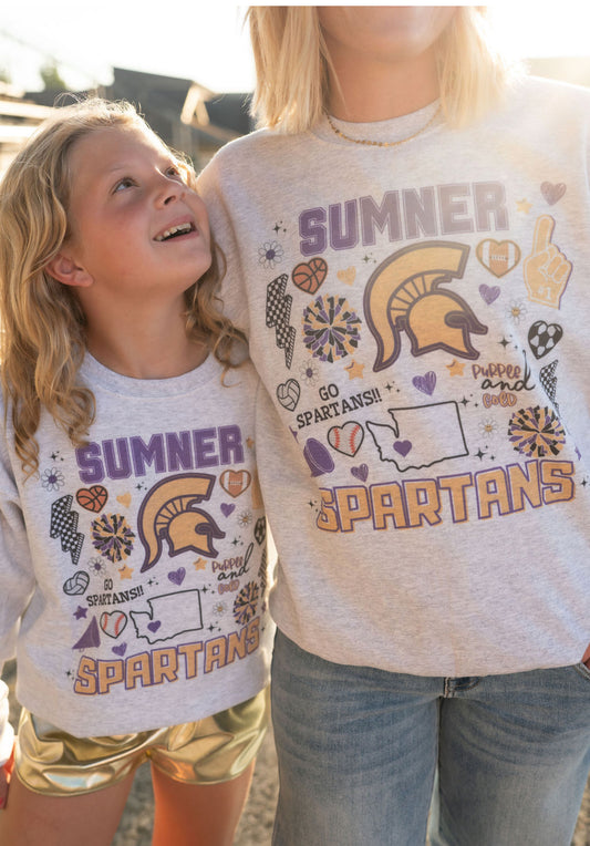 Details:

Youth sizing (true to size)
Unisex fit
Soft, cozy fleece interior
Designed with school spirit in mind: “Go Spartans!”
Exclusive Sumner-themed graphics including Washington state outline, cheer megaphone, foam finger, and more
Perfect for pep rallies, game days, and everyday pride
