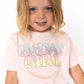 Let the birthday girl shine bright in this adorable pastel party tee! Featuring a magical ombré rainbow design outlined in rhinestones, this soft pink shirt is made for twirling, giggling, and blowing out candles in style.
