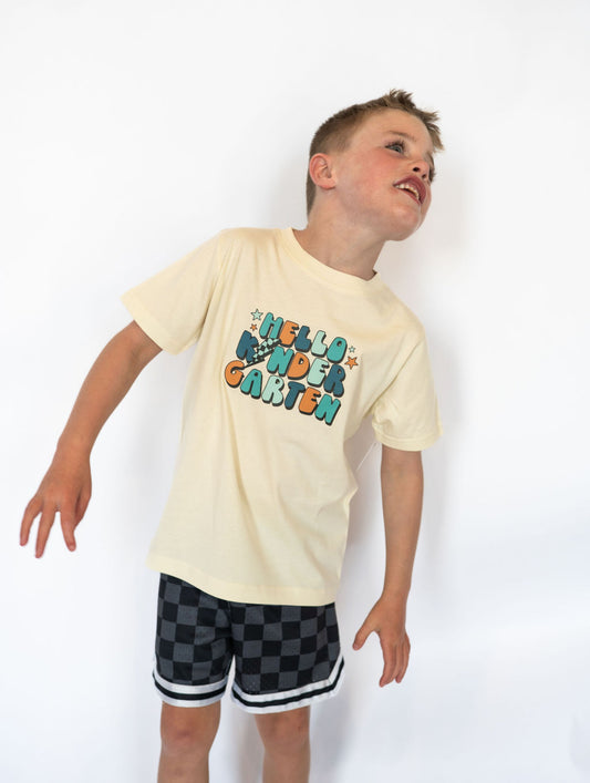Details:

Soft, lightweight cotton blend for maximum comfort
Cream base with multicolor “HELLO KINDERGARTEN” graphic
Unisex fit—easy to pair with shorts, jeans, or joggers
Ideal for first-day-of-school outfits and milestone memories
Available in youth sizes