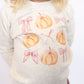 Ivory crewneck with pumpkin + pink bow print
Cozy, soft fabric perfect for cooler days
Classic crewneck fit for easy layering
Designed by Sweet Wink for playful seasonal style