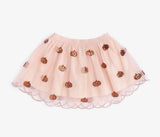 Sweet Wink soft orange scalloped tutu skirt with sparkling sequin pumpkin accents, layered tulle, cotton lining, and an elastic waistband for toddlers and little girls.