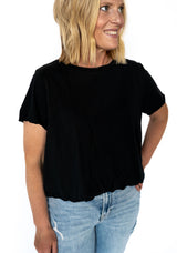 Timeless, flattering, and effortlessly cool—our black bubble tee is your wardrobe’s new best friend. With its relaxed fit and subtly cinched bubble hem, this essential tee adds instant polish to even your most laid-back looks. Dress it up or down, this one’s a multitasker.

✨ Pairs perfectly with everything from distressed denim to flowy skirts—because black truly goes with it all.

Details:

Buttery-soft fabric with breathable comfort

Bubble hem for a flattering, slightly cropped fit

Crew neckline &amp; 