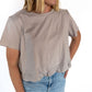 When neutrals call, this tee answers—softly and stylishly. Our taupe bubble tee blends relaxed comfort with elevated vibes thanks to its chic, cinched hem and flowy silhouette. It’s that perfect "I woke up like this" look, but make it intentional.

✨ A dreamy match for denim, white bottoms, or your go-to joggers—this muted tone plays well with everything.

Details:

Soft, breathable fabric with a light drape

Flattering bubble hem with relaxed fit

Crew neckline and; comfy short sleeves

Neutral taupe shade