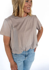 When neutrals call, this tee answers—softly and stylishly. Our taupe bubble tee blends relaxed comfort with elevated vibes thanks to its chic, cinched hem and flowy silhouette. It’s that perfect "I woke up like this" look, but make it intentional.

✨ A dreamy match for denim, white bottoms, or your go-to joggers—this muted tone plays well with everything.

Details:

Soft, breathable fabric with a light drape

Flattering bubble hem with relaxed fit

Crew neckline and; comfy short sleeves

Neutral taupe shade